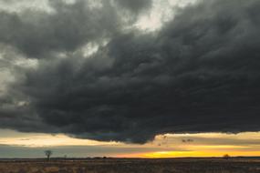 Storm Clouds over rural landscape at Sunset