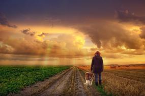 woman with dog on the field