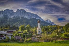 church in village at scenic mountains, summer landscape, Germany, zugspitze