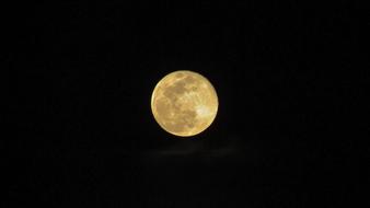 yellow moon on the black background