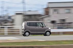 compact car rushing along the road in a blurred background