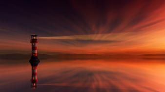 Beautiful reflection of a striped lighthouse in the water against a beautiful and colorful evening sky with sunset