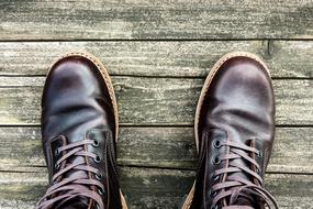 leather brown shoes on the wooden floor