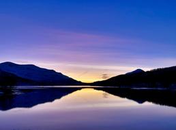 blue sunset over calm water