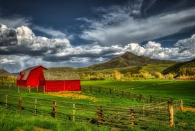 farm barn under dark clouds