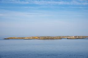 distant village on coast at calm sea, Sweden, BohuslÃ¤n