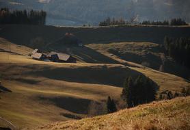 farm on the hill at dusk