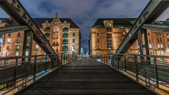 pedestrian Bridge at historical Buildings in night city, germany, hamburg