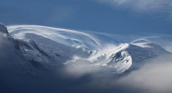 scenic Snowy Mountains beneath blue sky