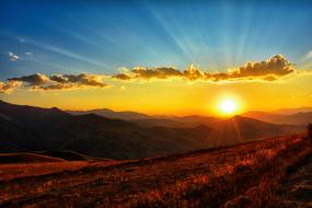 Beautiful landscape of the KaÅkars mountains with the colorful plants, in Turkey, at colorful and beautiful sunset in the sky with clouds