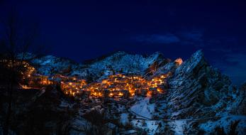 panoramic view of the night village in the mountains in Castelmezzano