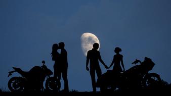 black silhouettes of loving couples on motorcycles as an illustration