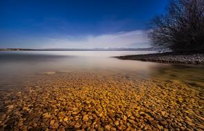 round orange stones on the shore of Lake Constance