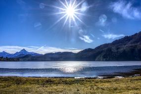 bright sun over the mountains in winter