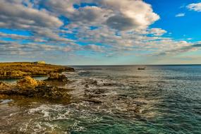 white clouds over the rocky coast of cyprus