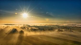 Beautiful foggy landscape in the sunlight