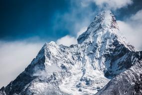 Ama Dablam, scenic peak of Himalaya Mountain at clouds