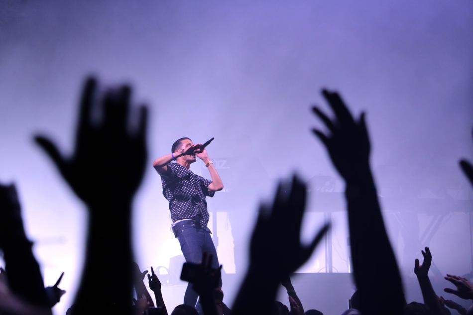 the hands of fans at the singer's concert