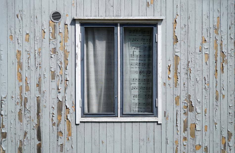 facade with peeling paint in the sun