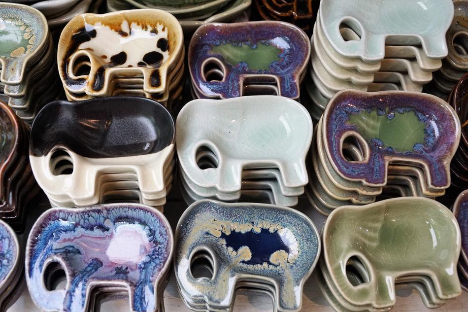 Colorful and beautiful, patterned, shiny plates in the shape of the elephants
