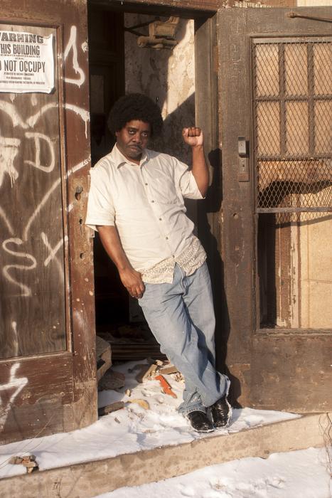 man in vintage 70s clothes at the door