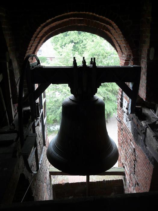 photo of a bronze bell in a church