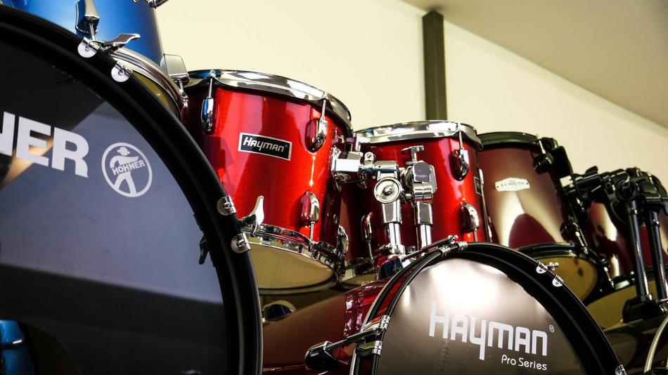 shining drum hayman kits at wall
