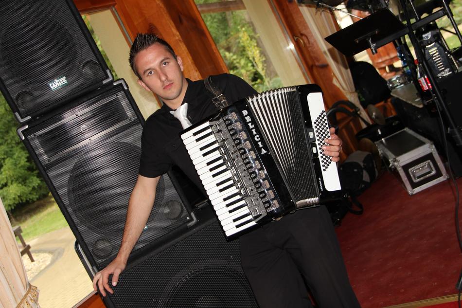Person with accordion near the speakers