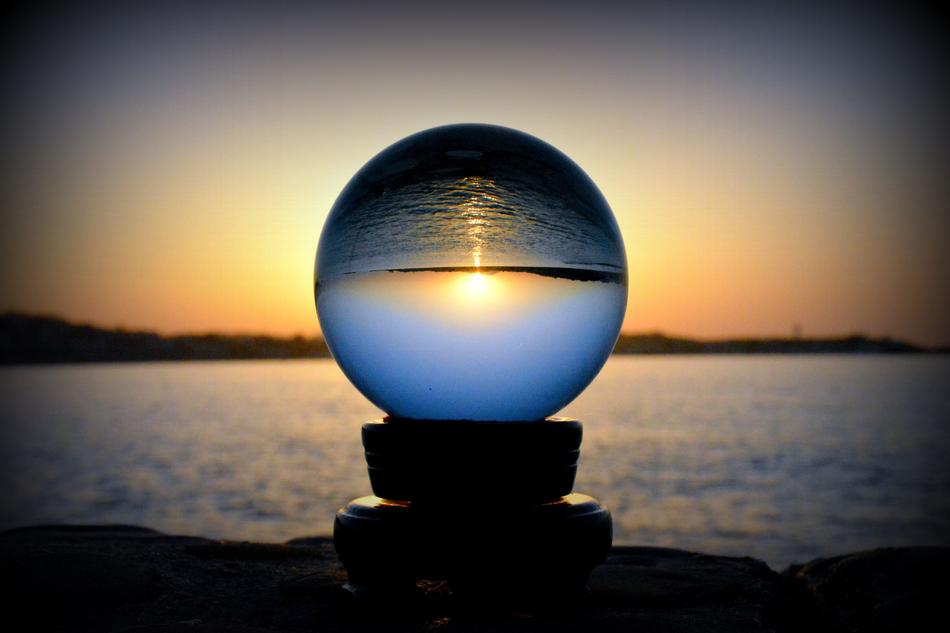 Sunset upside down in glass globe at dusk
