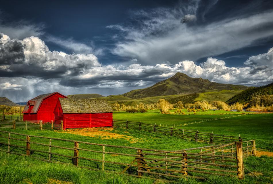 farm barn under dark clouds