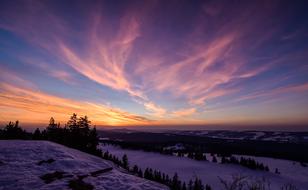landscape of wonderful Sky over the Trees on snowy hills