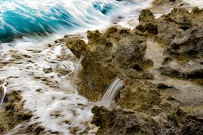 splashing waves on a rocky shore