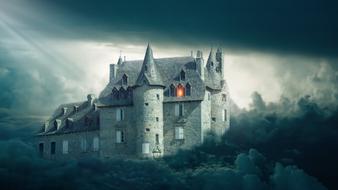 Beautiful castle with light among the clouds