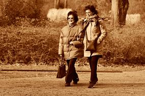 Two Women walking side by side