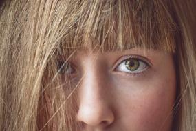 macro photo of a girl with tousled hair