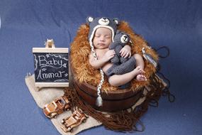 Sleeping newborn in pilot costume
