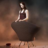 photoshoot of a young girl in a chair in a mystical mood