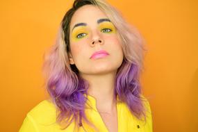 model with colorful hair and makeup