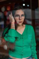 girl with glasses and green blouse