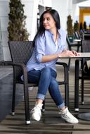 girl is sitting at a table in a cafe in Istanbul