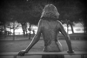 bronze Statue of Woman in a garden