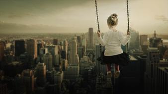 Girl on Swing over city