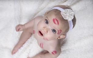 Baby with the kisses looks up