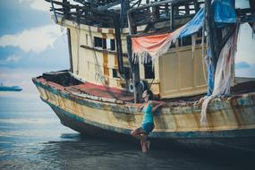 Female and old ship in Thailand Samui