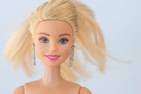 photo barbie doll with white hair and earrings