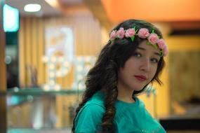 young Woman in pink flower wreath