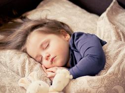 photo of a little girl who is sleeping sweetly