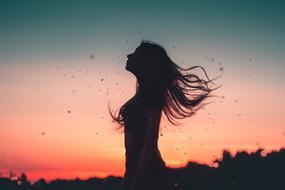 Wind Girls Hair at the red sunset