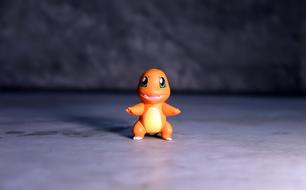 Small Cute anime Toy on a blurred background