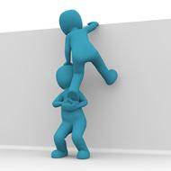 Blue figure, helping to climb another blue figure on the white wall, on clipart